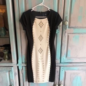 Fitted Black and White dress with gold accents
